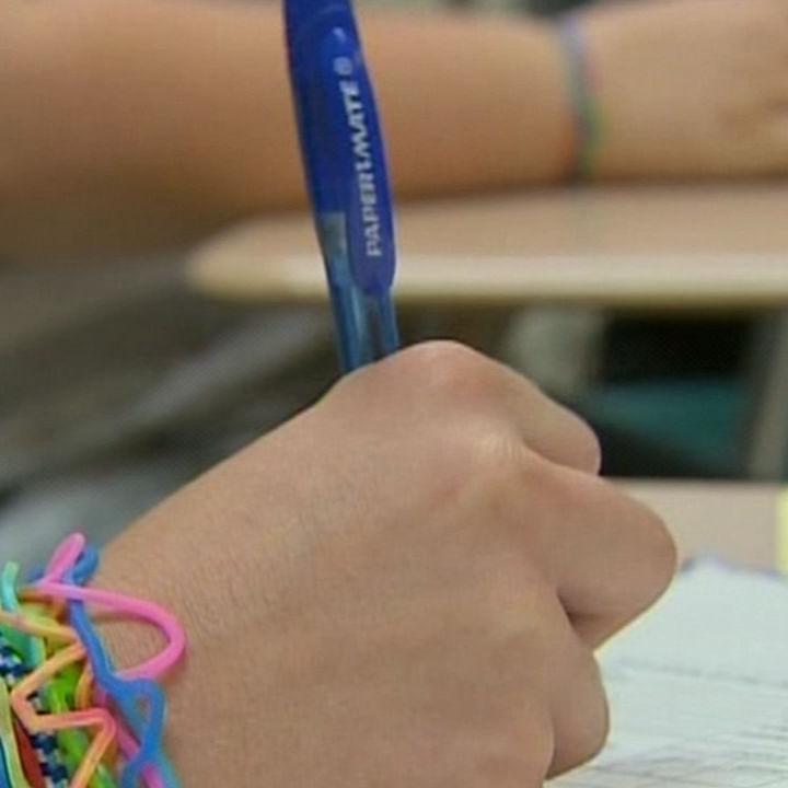 NORTH LAWRENCE SCHOOLS CLOSING 10PKG.transfer_frame_2621 hand.jpg